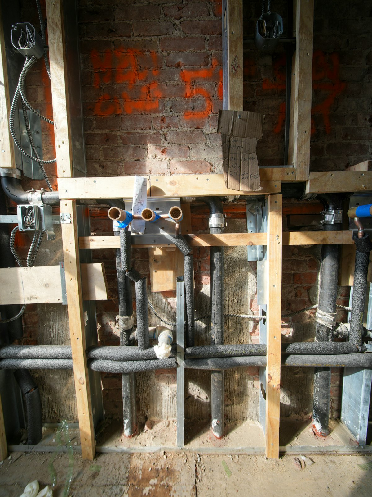 Commercial plumbing pipes being installed
