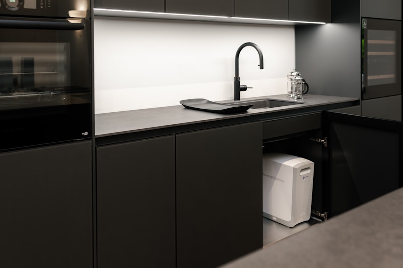 Reverse osmosis water purification unit installed under a kitchen sink