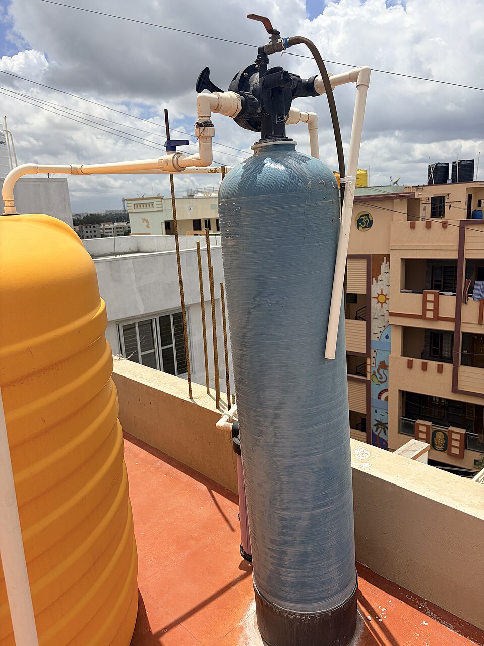 Whole-home water softener tank with multi-port control valve